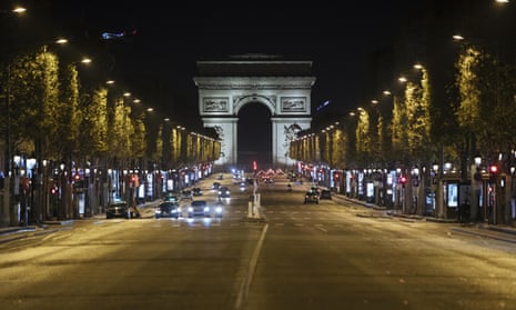 The Champs-Elysees avenue is almost empty on Saturday night.
