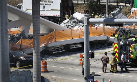 Multiple Fatalities Reported After Collapse Of Pedestrian Bridge In Miami<br>MIAMI, FL - MARCH 15: Vehicles are seen trapped under the collapsed pedestrian bridge that was newly built over southwest 8th street allowing people to bypass the busy street to reach Florida International University on March 15, 2018 in Miami, Florida. Reports indicate that there are an unknown number of fatalities as a result of the collapse, which crushed at least five cars. (Photo by Joe Raedle/Getty Images)