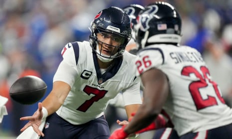 Houston Texans quarterback CJ Stroud (7) tosses the ball to running back Devin Singletary (26) during Saturday’s game at Lucas Oil Stadium.