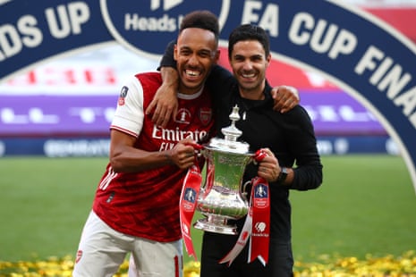 Arsenal captain Pierre-Emerick Aubameyang and manager Mikel Arteta celebrate with the trophy.