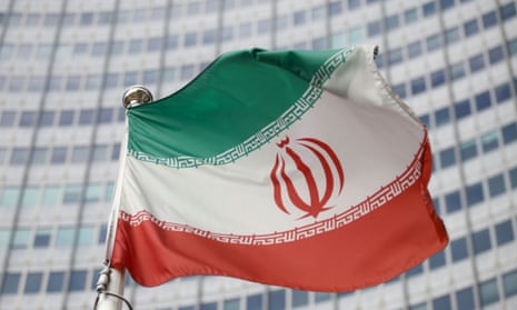 The Iranian flag waves in front of the International Atomic Energy Agency headquarters in Vienna