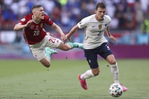 Roland Salé of Hungary jumped into the sky while battling for the ball with Benjamin Pavard of France.