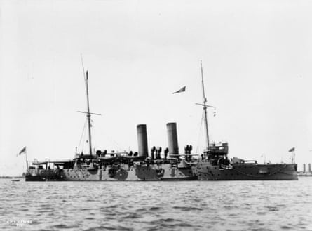 A black and white photo of the full length of a cruiser at sea
