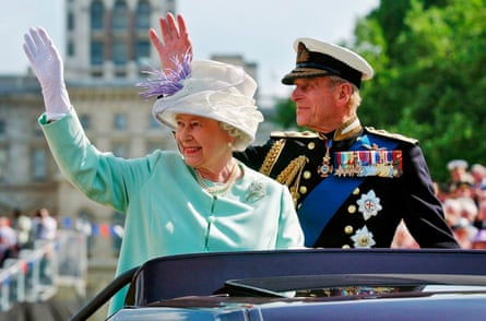 The Queen and Duke of Edinburgh wave to crowds in 2005 as they leave a show marking the end of the second world war.