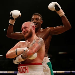 Lewis van Poetsch and Umar Sadiq share a laugh after their fight at the Copper Box Arena in London in 2017.