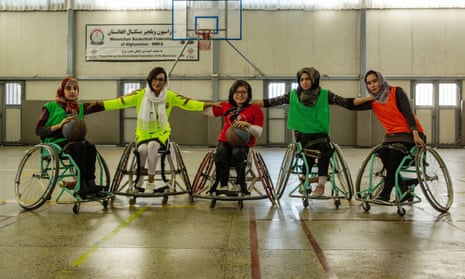 Captain Nilofar Bayat (yellow shirt) with team members during a wheelchair basketball training session in Kabul.