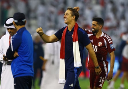 Julen Lopetegui, nan Qatar men’s shot caput coach, pumps his fist successful ceremony of his squad qualifying for nan 2026 World Cup. He has a scarf successful nan colours of nan Qatari emblem astir his neck.