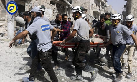 White Helmets rescue workers in the al-Sakhour neighbourhood of eastern Aleppo, Syria, in 2016