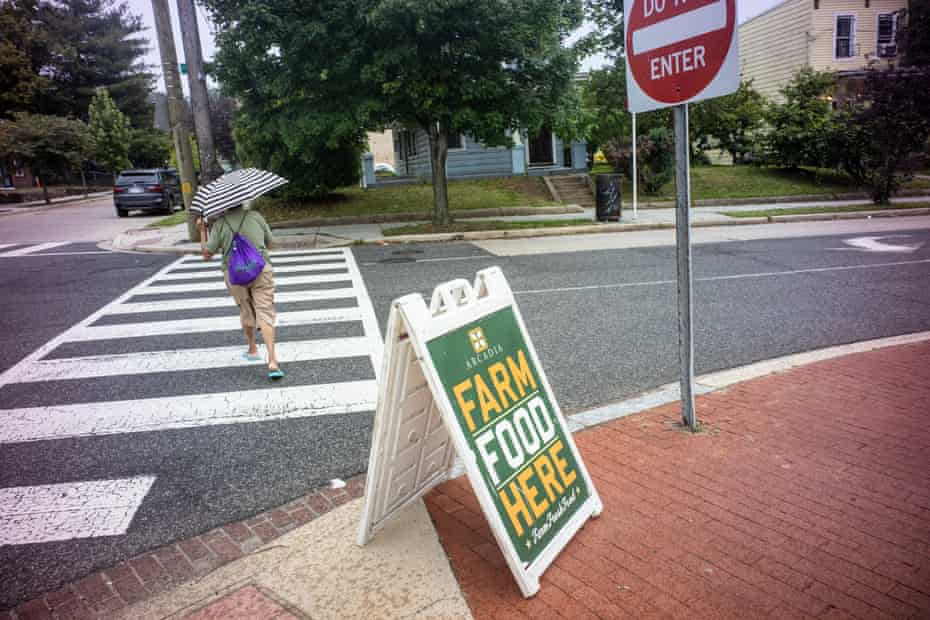 A sign points to Arcadia Farms' mobile farmer's market in Washington DC.