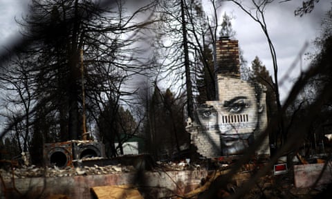A mural painted on chimney at a home destroyed by the Camp fire. 