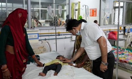 A doctor checks a boy suffering from heat related ailments at the Lalitpur district hospital, in Indian state of Uttar Pradesh, Saturday, 17 June 2023. Scientists have declared June 20203 as the hottest on record, and the first week of July the hottest week on record.
