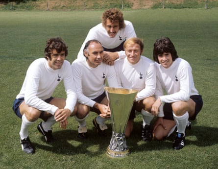 Martin Chivers leans on two Spurs teammates as he poses with the Uefa Cup in 1972 with Mike England, Alan Gilzean, Ralph Coates and Joe Kinnear.