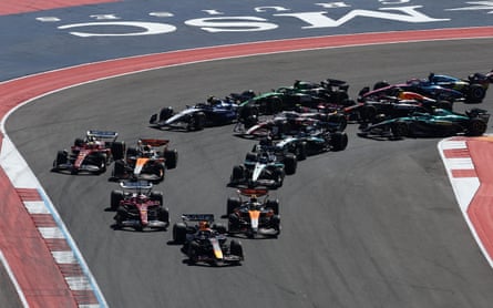 Red Bull’s Max Verstappen leads after the first corner at the start of the race ahead of McLaren’s Lando Norris and Ferrari’s Charles Leclerc