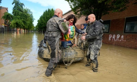 People are rescued in Faenza, Italy, Thursday, May 18, 2023.