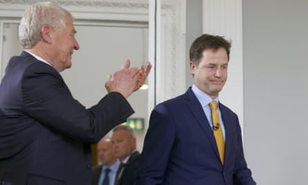 Former Lib Dem chief Paddy Ashdown (L) applauds Nick Clegg at a press conference where he announced his resignation as leader.
