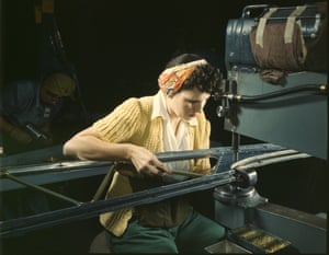 A riveting-machine operator pictured in October 1942 at a Douglas Aircraft Company plant in California, working on the wings of a B-17F heavy bomber, also known as a Flying Fortress.