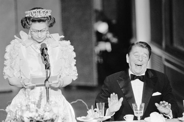 Ronald Reagan laughs after a joke made by a straight-faced Queen Elizabeth II, who commented on the lousy California weather she had experienced since her arrival in the US, 1983.