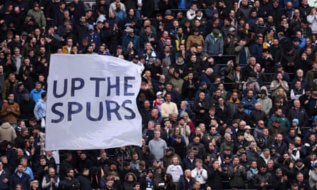 Tottenham fans hold up a banner which reads: ‘Up the Spurs’