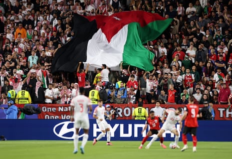 Fans of Jordan spread the big national flag