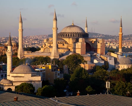 Exterior of the Hagia Sophia with a large main dome and minarets