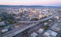 Aerial: Oakland City Skyline at sunset. California, USA<br>Aerial: Oakland City Skyline and freeway at sunset. California, USA