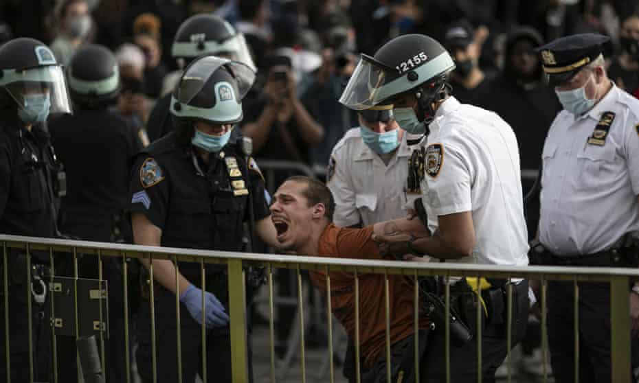 Police officers make an arrest during a rally calling for justice over the death of George Floyd, in Brooklyn, New York, on 1 June 2020.
