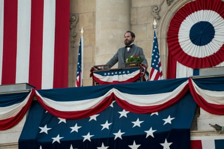 President James Garfield stands by a lectern on a balcony.
