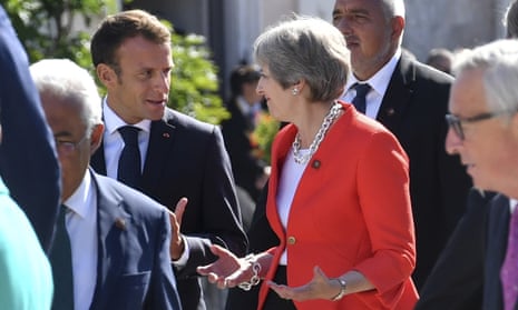 Emmanuel Macron, left, with Theresa May in Salzburg.
