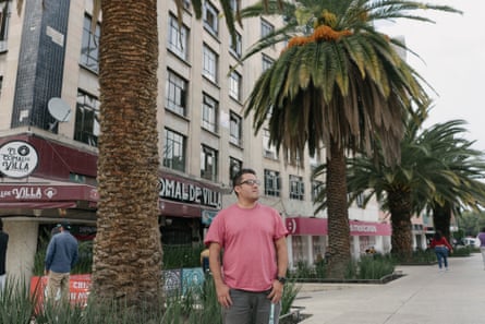 Christopher Gil Ortíz on a palm-tree-lined street