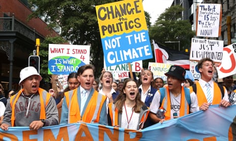 Students march through the streets during a strike to raise climate change awareness on 15 March in Wellington, New Zealand.