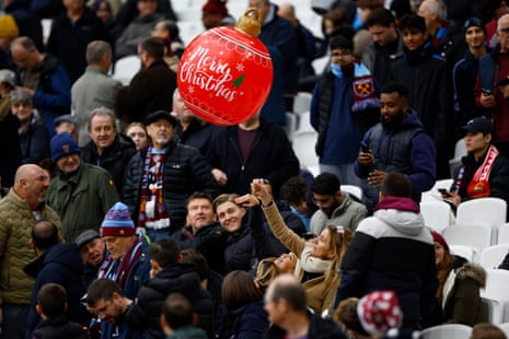 A inflatable Christmas ball is seen amongst West Ham United fans in the stands during half-time.