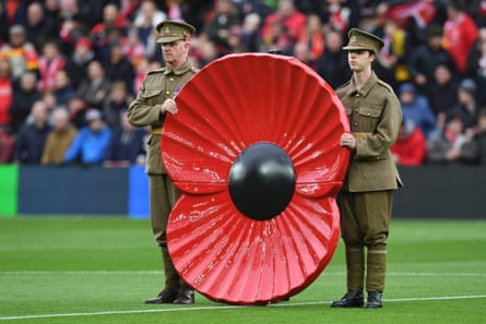 A giant poppy is displayed during the minute silence before a Premier League match between Liverpool and Watford at Anfield, Liverpool, in November 2016.