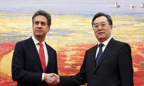 Miliband and Ding shake hands