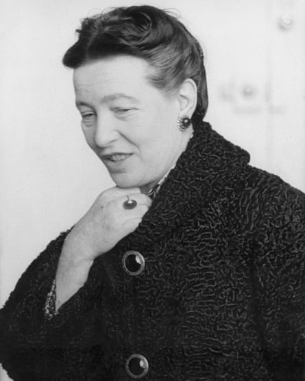 Simone de Beauvoir in the black Persian lamb coat she brought back from Russia.
