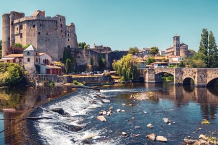 River, weir, bridge, castle and church in Italian-inspired architecture in a western French town