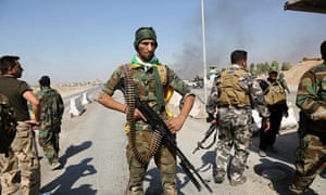 Iraqi forces patrol in the streets after they retake the control of the city center from peshmerga forces in Kirkuk, Iraq, on Monday.