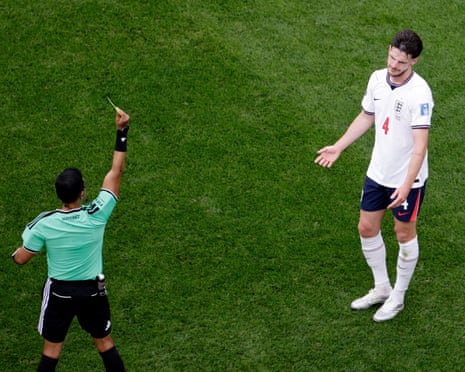 England's Declan Rice is shown a yellow card by referee Said Martinez.