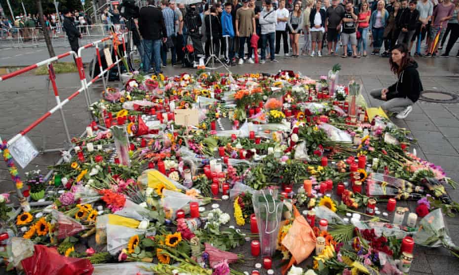 Floral tributes left at the crime scene after a shooting spree that left nine people dead in Munich.