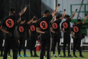 Players of MLS teams participate in a Black Lives Matter pre-game protest