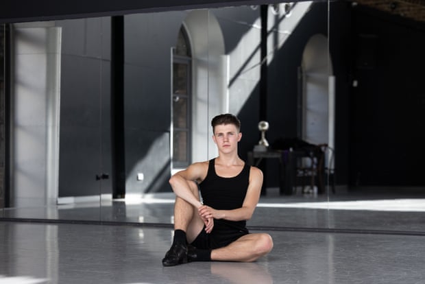 Liam Costello sitting on the floor