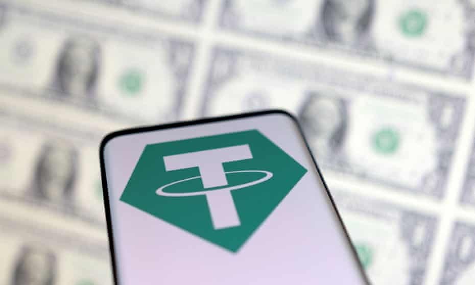 Illustration shows the tether logo on a smartphone above US dollars.