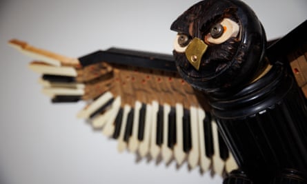 An owl sculpture by Marc Hackworthy made with old piano keys.