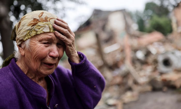 Raisa Shapoval, 83, cries in front of the site of a military strike in Chuhuiv, about 6 km from the frontline, amid Russia’s invasion of Ukraine, in Kharkiv region.
