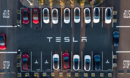 aerial view shows cars parked at the Tesla Fremont Factory in Fremont, California.