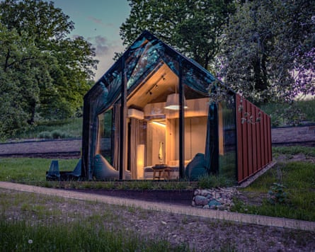 A glass cabin bedroom at Ziedlejas forest sauna in Latvia.