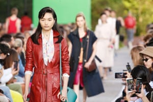 A model in a red leather trench A model in a red leather trench