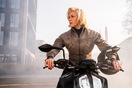 In her latest show, Ride or Die. She is pictured on a motorbike in a smoky urban scene