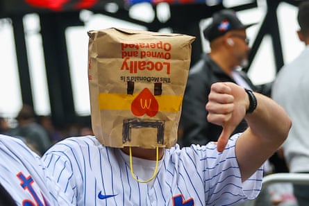 A New York Mets fan wears a paper bag over his head before the baseball game against the Washington Nationals