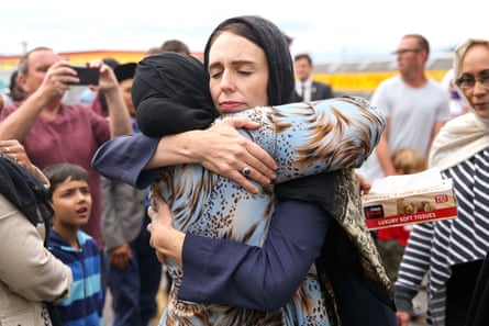The New Zealand prime minister, Jacinda Ardern, hugs a mosque-goer at the Kilbirnie Mosque on 17 March 2019 in Wellington, after fatal shooting attacks on two mosques in Christchurch two days prior.