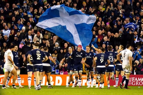 Duhan van der Merwe, his teammates and the Scotland fans celebrate after he scored his third try to complete his hat-trick against England.